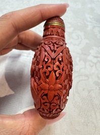 Nine Chinese cinnabar lacquer snuff bottles and a covered box, Qianlong marks, 19/20th C.
