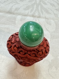 Nine Chinese cinnabar lacquer snuff bottles and a covered box, Qianlong marks, 19/20th C.
