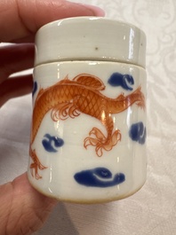 A Chinese iron-red 'Dragon' covered box, a blue and white '100 Boys' and a famille verte 'Fish' snuff bottle, Shunzhi mark, 19th C.