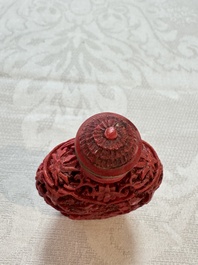 Nine Chinese cinnabar lacquer snuff bottles and a covered box, Qianlong marks, 19/20th C.