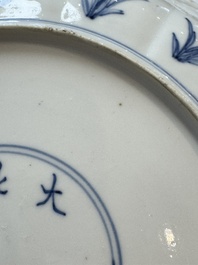 A pair of Chinese blue and white 'Hunting' plates, Chenghua marks, Kangxi