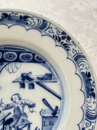 A pair of rare blue and white Dutch Delft 'Shoemaker' plates, 18th C.