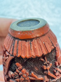 Nine Chinese cinnabar lacquer snuff bottles and a covered box, Qianlong marks, 19/20th C.