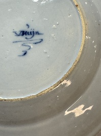 A pair of rare blue and white Dutch Delft 'Shoemaker' plates, 18th C.