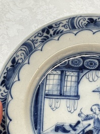A pair of rare blue and white Dutch Delft 'Shoemaker' plates, 18th C.