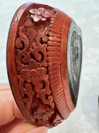 Nine Chinese cinnabar lacquer snuff bottles and a covered box, Qianlong marks, 19/20th C.