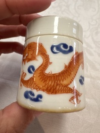 A Chinese iron-red 'Dragon' covered box, a blue and white '100 Boys' and a famille verte 'Fish' snuff bottle, Shunzhi mark, 19th C.