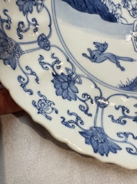 A pair of Chinese blue and white 'Hunting' plates, Chenghua marks, Kangxi