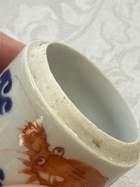 A Chinese iron-red 'Dragon' covered box, a blue and white '100 Boys' and a famille verte 'Fish' snuff bottle, Shunzhi mark, 19th C.