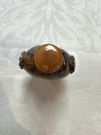 Five Chinese hardstone and glass snuff bottles, 20th C.