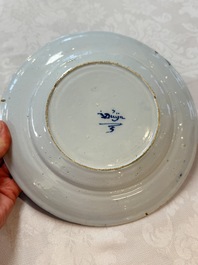 A pair of rare blue and white Dutch Delft 'Shoemaker' plates, 18th C.