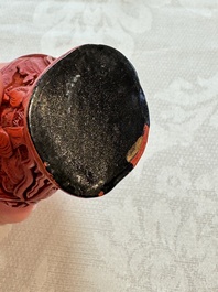 Nine Chinese cinnabar lacquer snuff bottles and a covered box, Qianlong marks, 19/20th C.