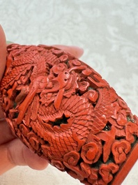 Nine Chinese cinnabar lacquer snuff bottles and a covered box, Qianlong marks, 19/20th C.