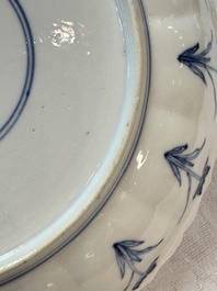 A pair of Chinese blue and white 'Hunting' plates, Chenghua marks, Kangxi