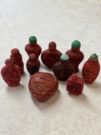 Nine Chinese cinnabar lacquer snuff bottles and a covered box, Qianlong marks, 19/20th C.