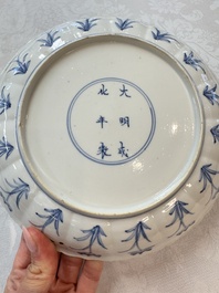 A pair of Chinese blue and white 'Hunting' plates, Chenghua marks, Kangxi