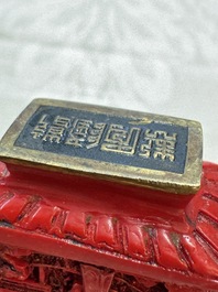 Nine Chinese cinnabar lacquer snuff bottles and a covered box, Qianlong marks, 19/20th C.