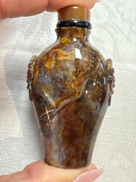 Five Chinese hardstone and glass snuff bottles, 20th C.