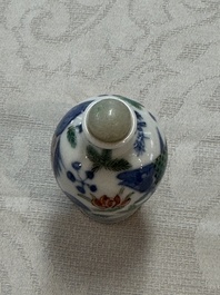 A Chinese iron-red 'Dragon' covered box, a blue and white '100 Boys' and a famille verte 'Fish' snuff bottle, Shunzhi mark, 19th C.