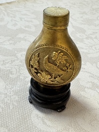 A Chinese gilt-bronze and mother-of-pearl-inlaid snuff bottle with birds among flowering branches, Guangxu mark and of the period