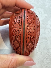 Nine Chinese cinnabar lacquer snuff bottles and a covered box, Qianlong marks, 19/20th C.