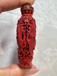 Nine Chinese cinnabar lacquer snuff bottles and a covered box, Qianlong marks, 19/20th C.