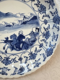 A pair of Chinese blue and white 'Hunting' plates, Chenghua marks, Kangxi