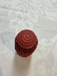 Nine Chinese cinnabar lacquer snuff bottles and a covered box, Qianlong marks, 19/20th C.