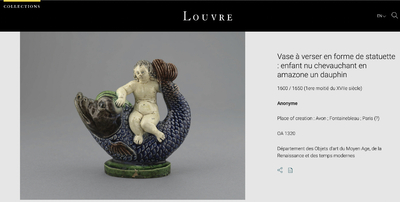 A blue and white Dutch Delft ewer in the shape of a putto on a dolphin on a wavy green ground, 18th C.