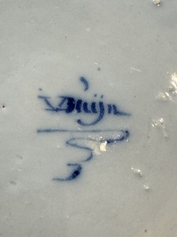 A pair of rare blue and white Dutch Delft 'Shoemaker' plates, 18th C.