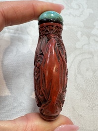 Nine Chinese cinnabar lacquer snuff bottles and a covered box, Qianlong marks, 19/20th C.