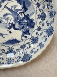 A pair of Chinese blue and white 'Hunting' plates, Chenghua marks, Kangxi