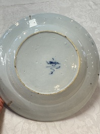 A pair of rare blue and white Dutch Delft 'Shoemaker' plates, 18th C.