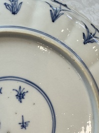 A pair of Chinese blue and white 'Hunting' plates, Chenghua marks, Kangxi