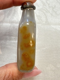 Five Chinese hardstone and glass snuff bottles, 20th C.