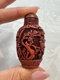 Nine Chinese cinnabar lacquer snuff bottles and a covered box, Qianlong marks, 19/20th C.