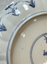A pair of Chinese blue and white 'Hunting' plates, Chenghua marks, Kangxi