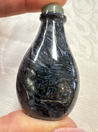 Five Chinese hardstone and glass snuff bottles, 20th C.
