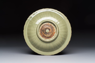 A Chinese Longquan celadon inscribed dish with incised floral design, Ming