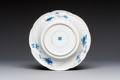 Four Chinese blue and white moulded plates with floral design, Kangxi