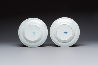 A pair of rare blue and white Dutch Delft 'Shoemaker' plates, 18th C.