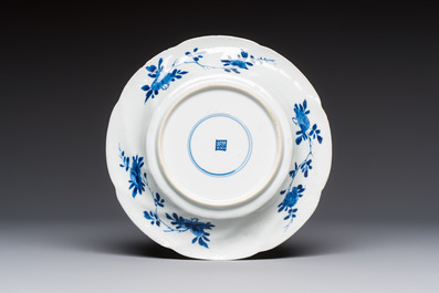 Four Chinese blue and white moulded plates with floral design, Kangxi