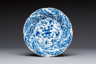 Four Chinese blue and white moulded plates with floral design, Kangxi