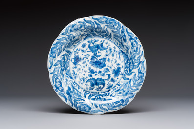 Four Chinese blue and white moulded plates with floral design, Kangxi
