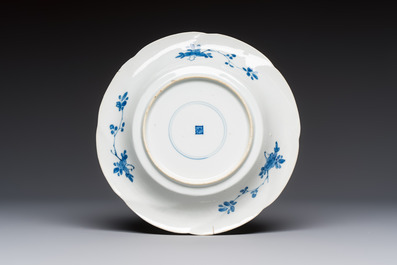 Four Chinese blue and white moulded plates with floral design, Kangxi