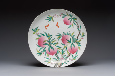 A Chinese famille rose 'Nine Peaches' dish on wooden stand, Yongzheng mark, 20th C.