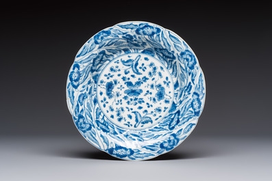 Four Chinese blue and white moulded plates with floral design, Kangxi