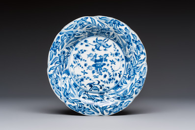 Four Chinese blue and white moulded plates with floral design, Kangxi