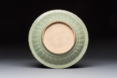 An unusual Chinese blue and white celadon-back 'Buddhist Lion' plate, Ming