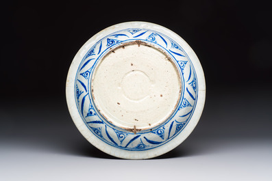 A Persian blue, white, and green glazed dish with stylised floral design, Safavid, 17/18th C.